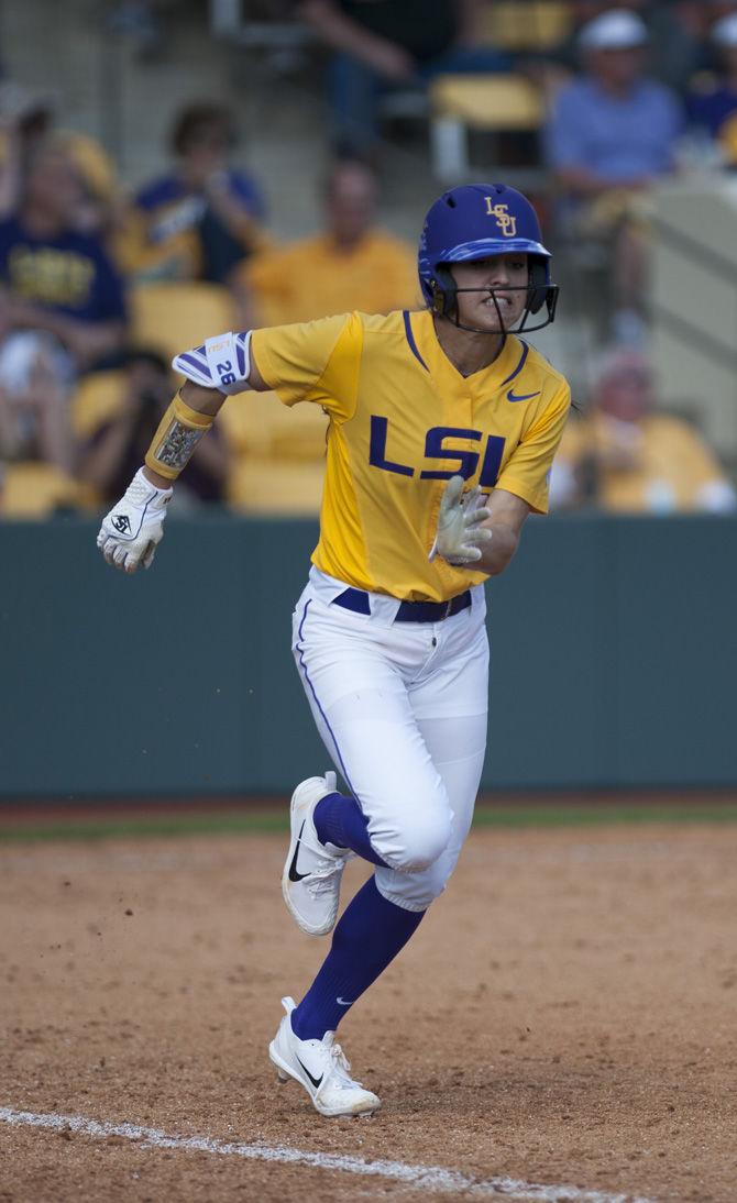 LSU senior outfielder Bailey Landry (26) runs to first base during the Tigers' 5-2 victory over OSU on Sunday, Feb. 12, 2017, at Tiger Park.