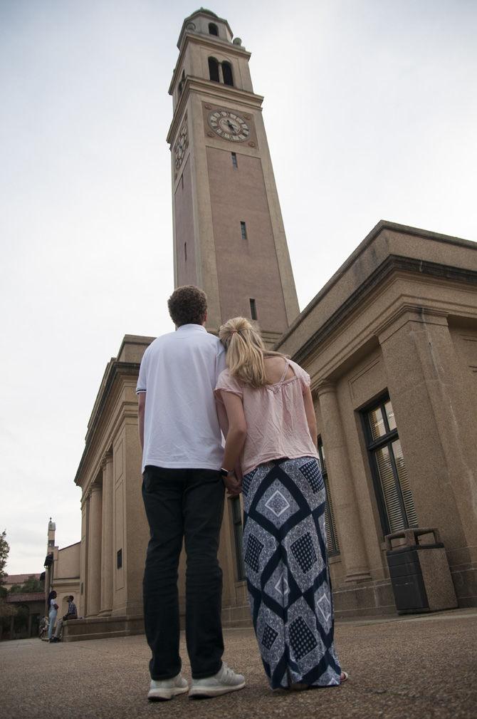 Couple follows Valentine's Day tradition of kissing in front of Memorial Tower on Wednesday, Feb. 8, 2017, on campus.