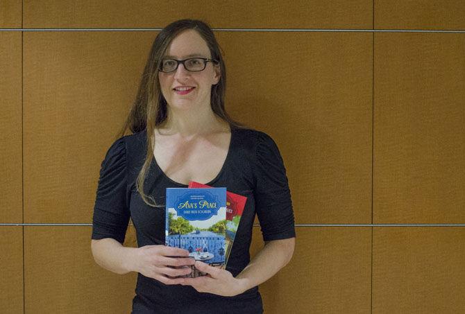 Author Emily Beck Cogburn holds her recently published book "Ava's Place" on Tuesday, Feb. 21, 2017, in the Student Union.