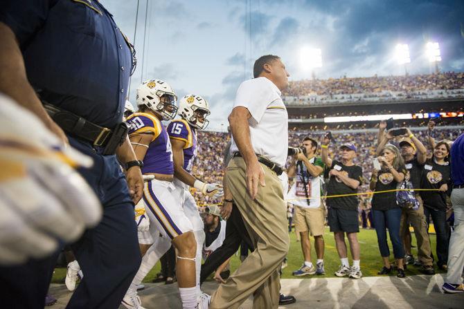 LSU interim head coach Ed Orgeron leads the Tigers out of the locker room before the LSU 45-10 win against Southern Mississippi on Saturday Oct. 15, 2016, in Tiger Stadium.