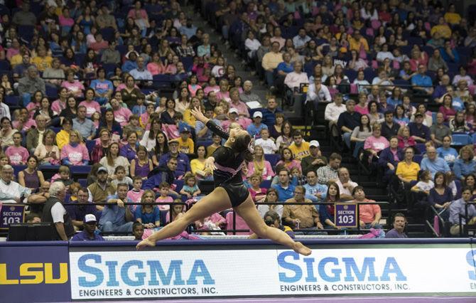 LSU all-around sophomore gymnast Sarah Finnegan leaps into mid-air during the Tigers' 197.475 - 192.625 win over Texas Woman's University on Friday, Jan. 20, 2017 in the Pete Maravich Assembly Center.