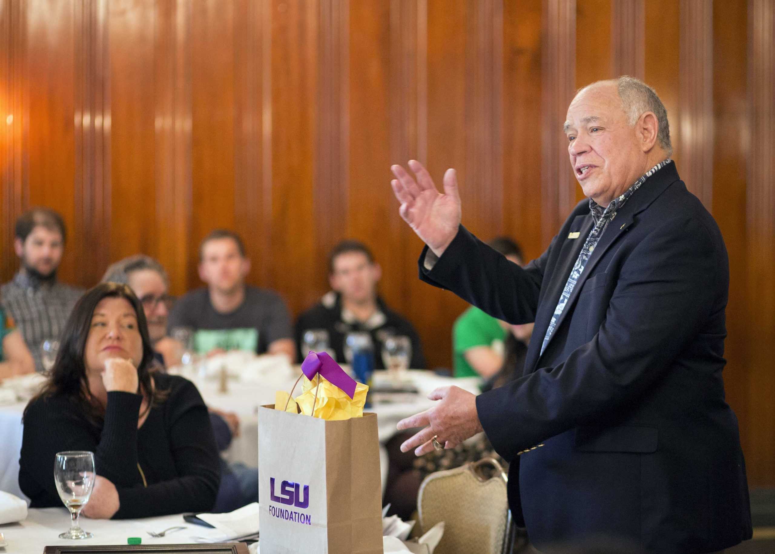 Former space shuttle commander presents two students with scholarships