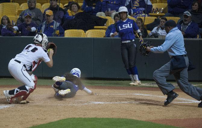 LSU freshman utility Nicky Dawson (10) slides in for a home run during the Tigers’ 10-2 victory over ISU on Friday, March 3, 2017, at Tiger Park.