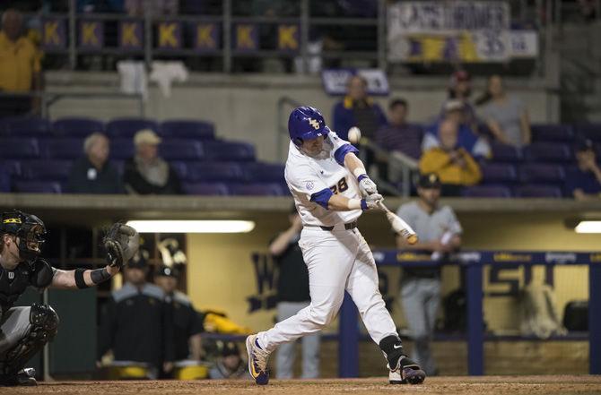 LSU senior catcher Jordan Romero (28) hits a pitch during the 6-1 win against Wichita State University on Friday, March 10, 2017 at Alex Box Stadium.