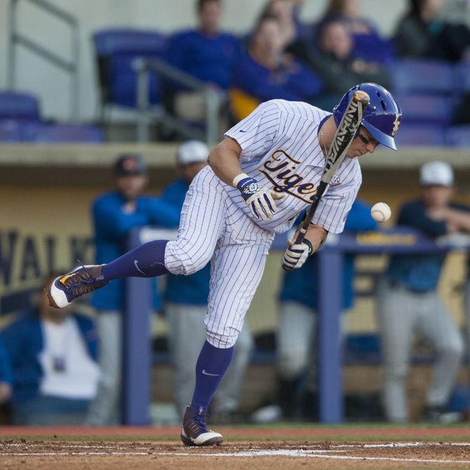 LSU senior infielder Cole Freeman (8) gets hit by the ball on Tuesday, March 14, 2017, during the Tigers 13-0 victory over Louisiana College at Alex Box Stadium.