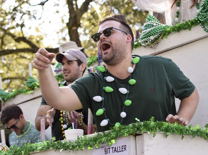 Parade participant throws beads to the crowd at the St. Patrick's Day Parade on Saturday, March 18, 2017 in Baton Rouge.