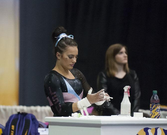 LSU all-around sophomore gymnast Lexie Priessman prepares for her uneven bar routine during the Tigers' 197.475-192.625 victory over Texas Women's University on Friday, Jan. 20, 2017, in the Pete Maravich Assembly Center.