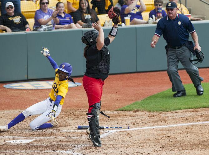 LSU freshman outfielder Aliyah Andrews (4) slides into home base during the Tigers&#8217; 2-0 victory over Georgia on Sunday, March 26, 2017, at Tiger Park.