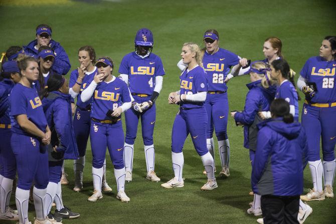 The team takes the field after the Lady Tigers' 3-0 loss to Minnesota on Saturday, March 4, 2017 at Tiger Park.