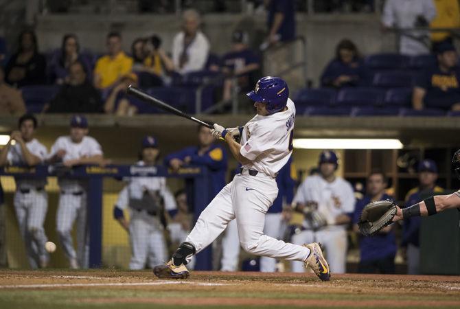 LSU freshman infielder Josh Smith (4) hits a pitch during the 6-1 win against Wichita State University on Friday, March 10, 2017 at Alex Box Stadium.