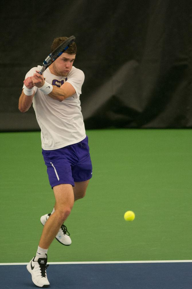 LSU junior Jordan Daigle returns the ball during LSU's defeat against the University of Alabama on Friday, March 18, 2016 at the LSU Tennis Facility