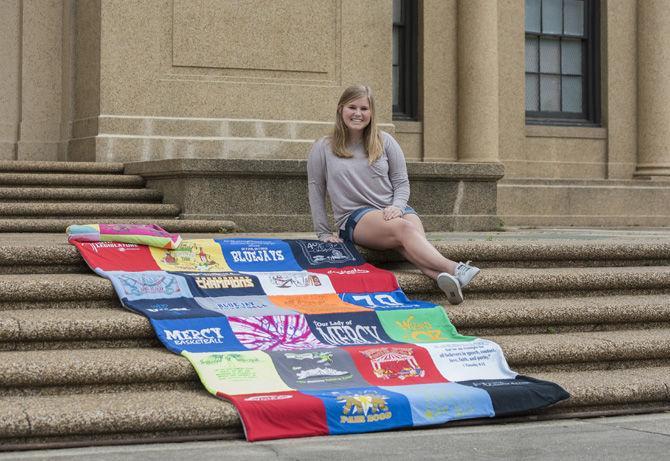 LSU pre-nursing freshman Katherine Saucier sits next to one of her t-shirt blankets on March 6, 2017.