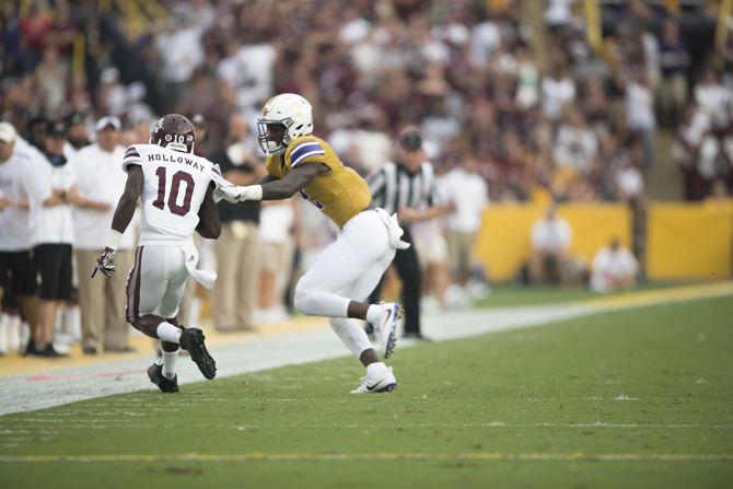 LSU sophomore cornerback Kevin Toliver II (2) forces Mississippi State senior running back Brandon Holloway (10) out of bounds during the Tigers' 23-20 victory on Saturday Sept. 17, 2016 at Tiger Stadium.