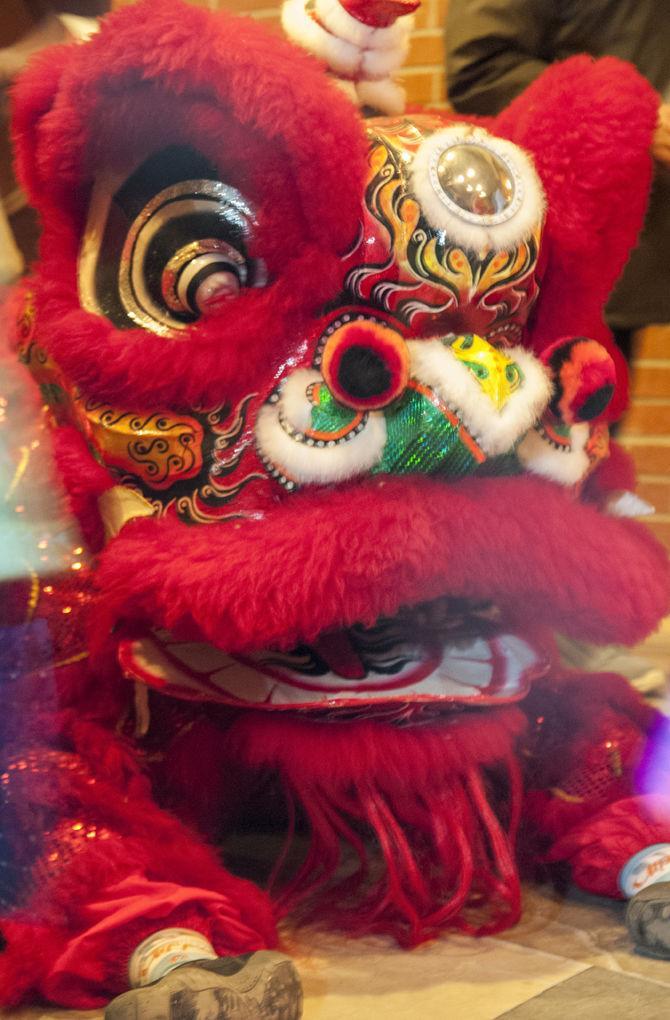 A GDPT Thien Ai lion dancer rests as Tam Bao Temple celebrates T&#7871;t, the Vietnamese New Year, in Baton Rouge on Jan. 27, 2017.