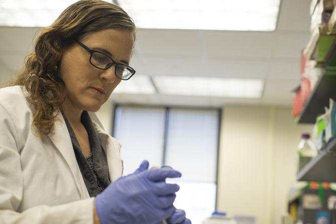 Assistant professor Morgan Kelly at work in her lab on Monday, March 6, 2017 in the Life Sciences Annex.