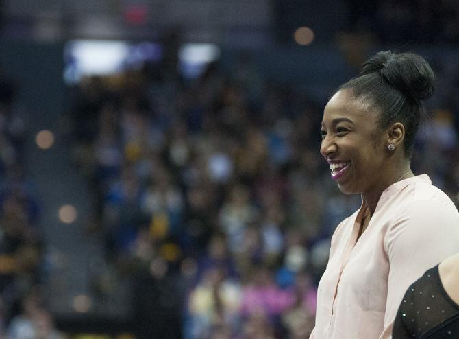 LSU volunteer coach Ashleigh Clare-Kearney smiles from the sidelines during the Tigers' 196.575-195.100 victory against Kentucky for the Pink &amp; Blue Meet on Friday, Jan. 22, 2016 in the PMAC.