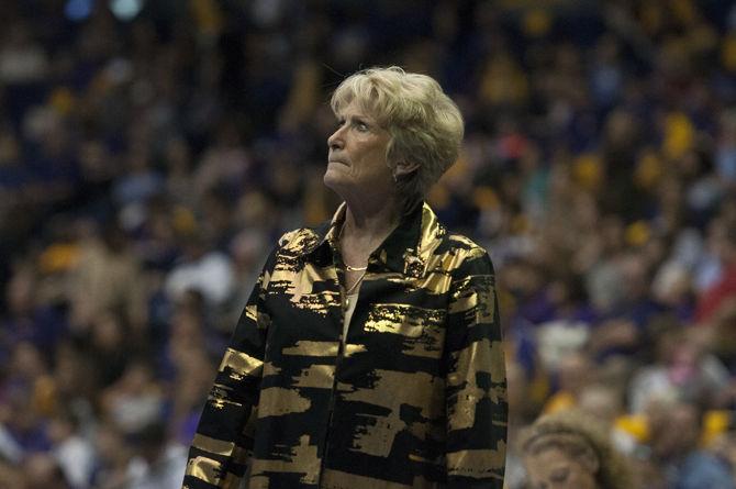 LSU head coach D-D Breaux watches the Tigers warm up on the balance beam during their 197.875-195.300 victory against the University of New Hampshire on Friday, March 10, 2017 in the PMAC.