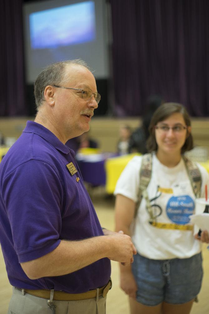 Director of Academic Programs Abroad Harald Leder and mass communication freshman Kate Roy discuss the LSU in Germany program on Oct. 18, 2016 during the Study Abroad Fair in the Royal Cotillion Ballroom in the LSU Student Union.