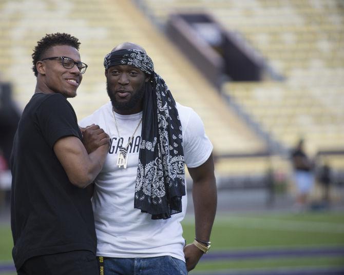 Former LSU players Malachi Dupre and Leonard Fournette greet each other before the Tigers' spring game on Saturday, April 22, 2017 at Tiger Stadium.