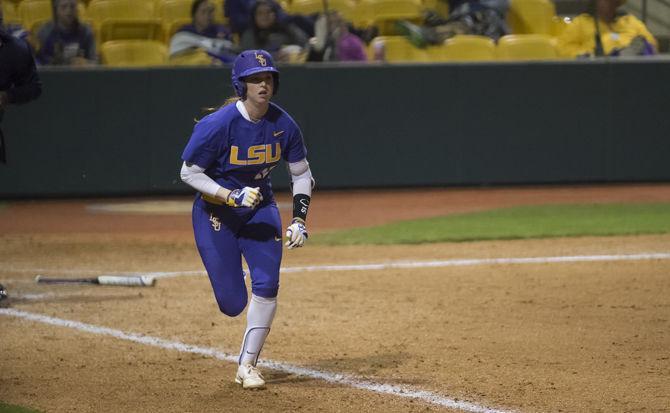 <p>LSU freshman infielder Sydney Springfield (15) makes for first base during the Tigers' 3-0 loss to Minnesota on Saturday, March 4, 2017 at Tiger Park.</p>