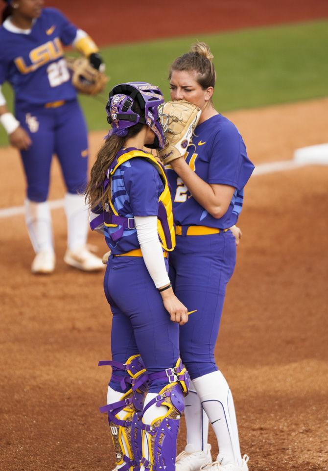 LSU senior catcher and infielder Sahvanna Jaquish (2) and LSU junior pitcher Carley Hoover (21) confer before their next pitch during the Tigers&#8217; 4-3 victory over McNeese State University on Saturday, Feb. 11, 2017, in Tiger Park.