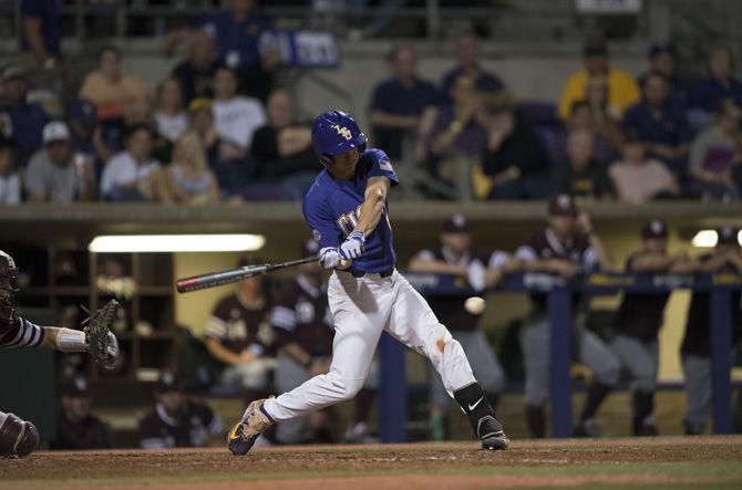 LSU freshman infielder and outfielder Zach Watson (9) swings at a pitch during the Tigers' 7-4 win against Texas A&amp;M on Friday, March 31, 2017 at Alex Box Stadium.