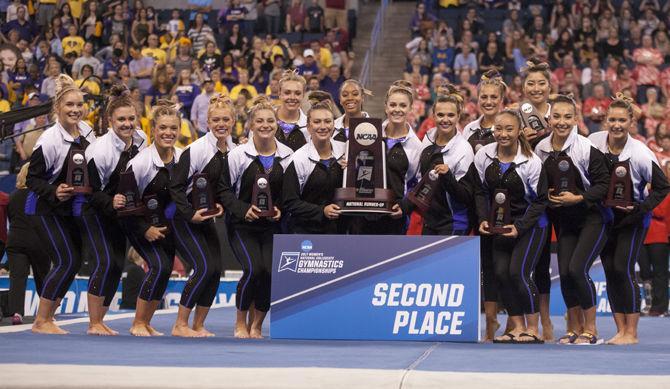 The LSU gymnastics team celebrates during the Tigers' 197.7375 score for second place finish in the NCAA Super Six National Championship on Saturday, April 15, 2017 in the Chaifetz Arena in St. Louis, Missouri.