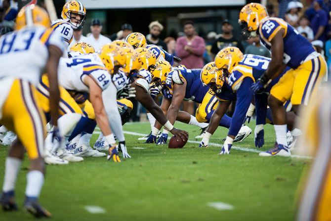 LSU football players wait for senior quarterback Danny Etling (16) to snap the football during 2017 Spring football game on Saturday, April 22, 2017.