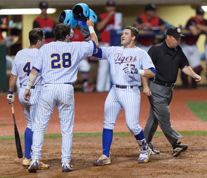 The LSU baseball team celebrates on Tuesday, April 18, 2017, during the Tigers&#8217; 10-4 victory over Lamar at Alex Box Stadium.