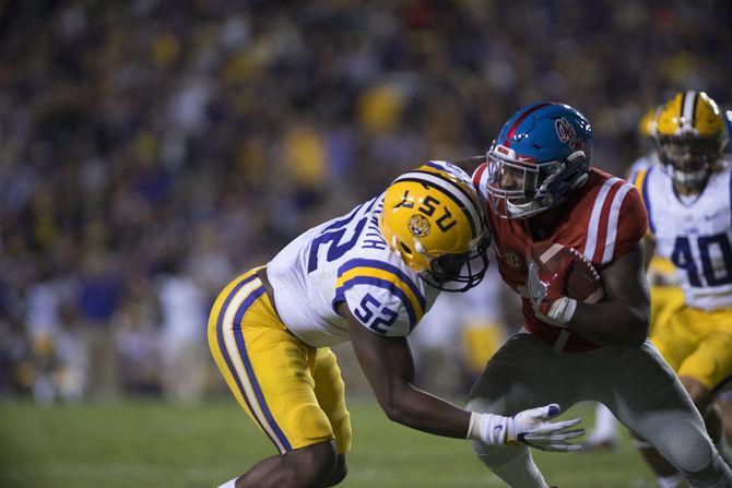 LSU senior linebacker Kendell Beckwith (52) taking down an Ole Miss player on Saturday Oct. 22, 2016 during the Tigers' 38-21 victory over the Rebels at Tiger Stadium.