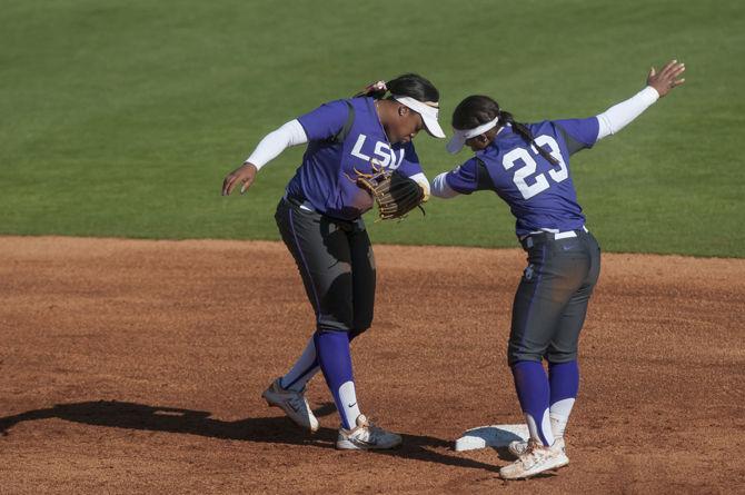 LSU senior infielder Bianka Bell (27) and freshman infielder Shemiah Sanchez (23) dab during the Tigers' 9-1 victory against Illinois State on Saturday, Feb. 27, 2016 in Tiger Park.