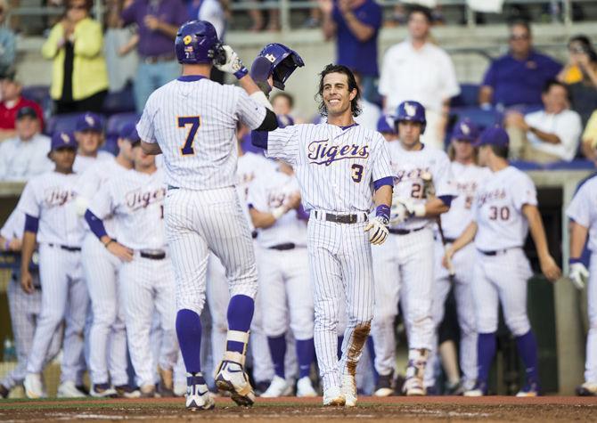 LSU's junior infielder Greg Deichmann (7) celebrates with Kramer Robertson (3) after hitting a home run during the first inning against the University of South Alabama on Tuesday May 9, 2017, at Alex Box Stadium.