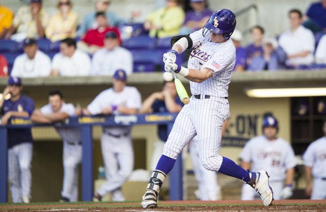 LSU's junior infielder Greg Deichmann (7) hits a home run during the first inning against the University of South Alabama on Tuesday May 9, 2017, at Alex Box Stadium.