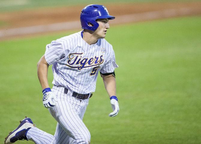 LSU Freshman Jake Slaughter (5) runs to first base after hitting a ground ball during the Tigers 7-6 loss against the University of South Alabama on Tuesday May 9, 2017, in Alex Box Stadium.