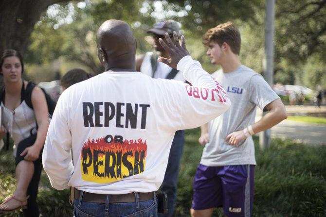 Members of the Consuming Fire Fellowship elicit a student response on Sept. 27, 2016 in Free Speech Plaza near the LSU Student Union.