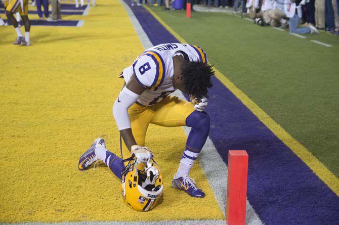 LSU freshman cornerback Saivion Smith (8) kneels during Tigers' 38-21 Victory against University of Mississippi on Oct. 22, 2016, in Death Valley.