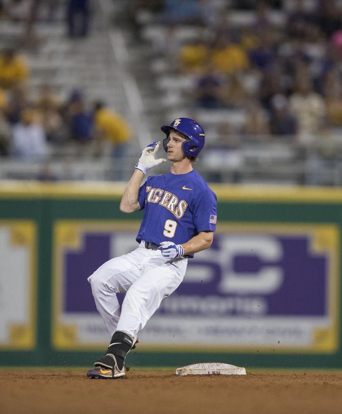 LSU freshman infielder and outfielder Zach Watson (9) watches the ball as it is thrown to the pitcher during the Tigers' 7-4 win against Texas A&amp;M on Friday, March 31, 2017 at Alex Box Stadium.