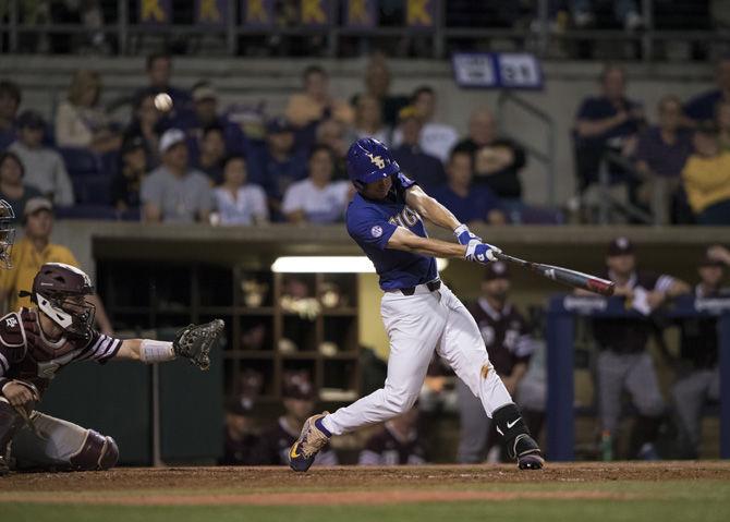 LSU freshman infielder and outfielder Zach Watson (9) hits a foul ball during the Tigers' 7-4 win against Texas A&amp;M on Friday, March 31, 2017 at Alex Box Stadium.