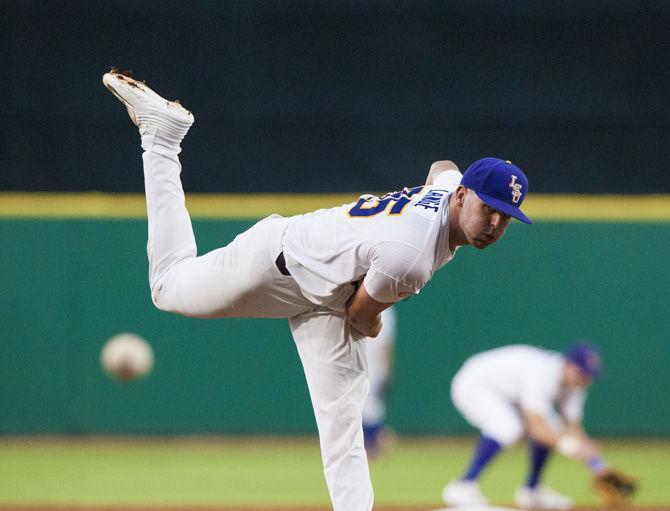 LSU junior pitcher Alex Lange (35) pitches the ball during warm up before LSU's 4-3 win against Mississippi State on Saturday June 10, 2017, at Alex Box Stadium.