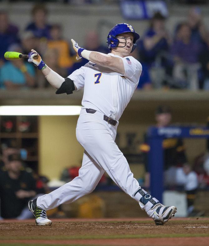 LSU junior infielder Greg Deichmann (7) swings the bat on Friday, Feb. 24, 2017, during the Tigers 6-1 victory over Maryland at Alex Box Stadium.