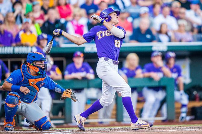 LSU sophomore outfielder Antoine Duplantis (20) hits a pop fly to center field during the Tigers' 4-3 loss against the Gators on Monday June 26, 2017, at TD Ameritrade Park in Omaha, Nebraska.