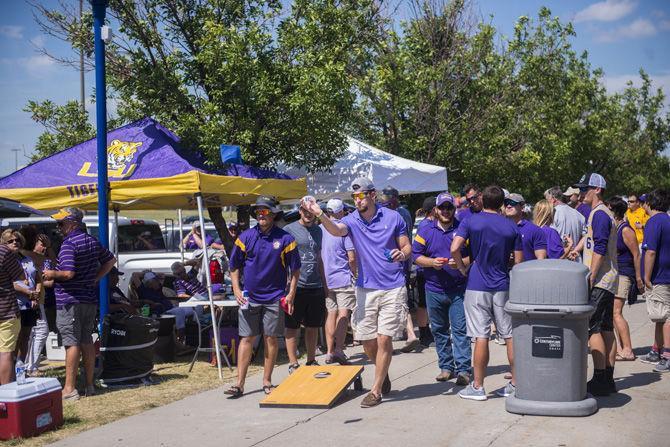 LSU Tiger fans tailgate outside of the TD Ameritrade Park in Omaha waiting for game two to start on Tuesday June 27, 2017.