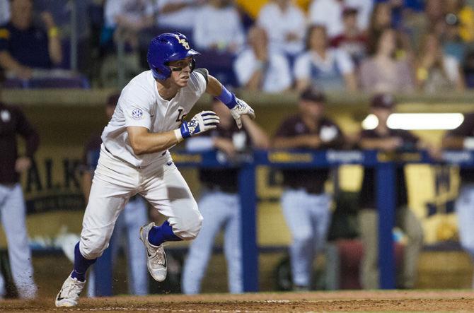 LSU senior second basemen Cole Freeman (8) starts running to first base during LSU's 4-3 win against Mississippi State on Saturday June 10, 2017, at Alex Box Stadium.