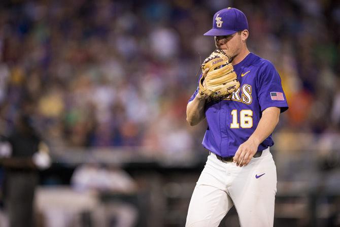 LSU senior pitcher Jared Poch&#233; (16) walks off the field for a pitcher change during the Tigers' 6-1 loss against Florida on Tuesday June 27, 2017, at TD Ameritrade Park in Omaha, Nebraska.