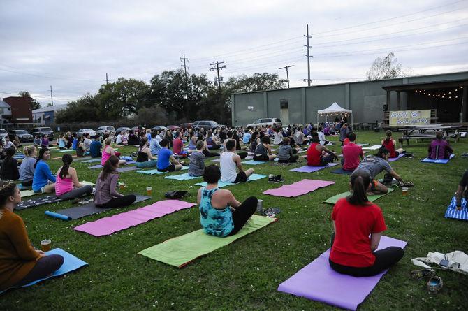 Tin Roof Brewery and lululemon team up on Wednesday, March 8, 2017, to hold the weekly Yoga on Tap workout class at Tin Roof Brewery off Nicholson Drive.