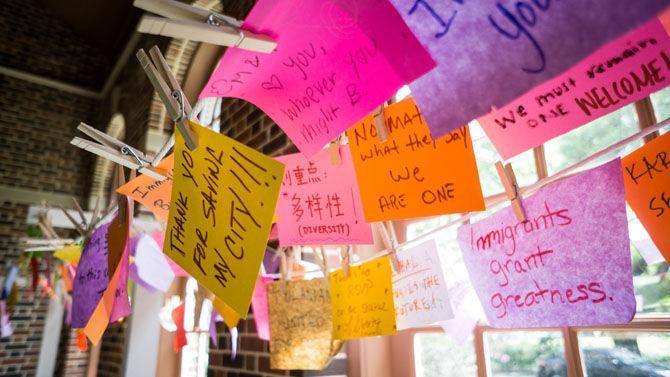 Students write messages of support for individuals who affected by the recent executive order on immigration Museum on Wednesday, April 12, 2017, at Newcomb Art at Tulane University in New Orleans.