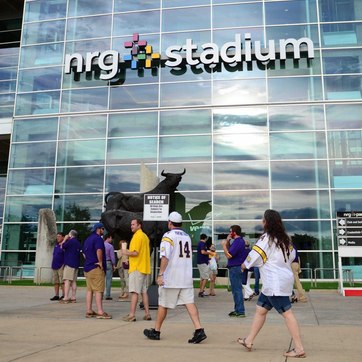 Fans enter the NRG stadium for LSU's first game this season August 30, 2014 against Wisconsin. The Tigers will return to Houston in 2017 to face BYU.