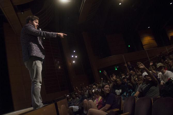 Mentalist Sean Bott chooses volunteers in the audience on Thursday, Aug. 24, 2017 at the Student Union Theater.