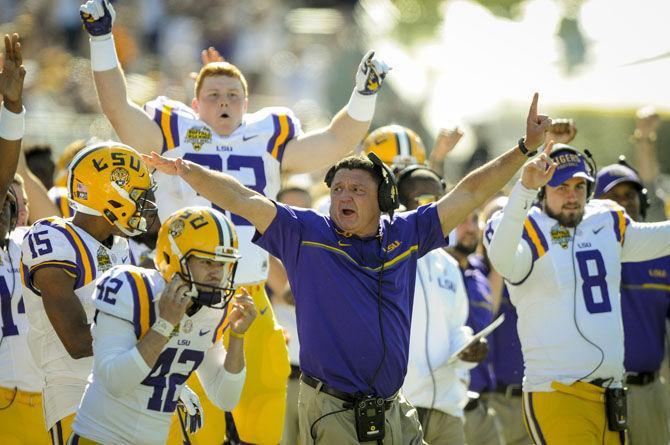 LSUhead coach Ed Orgeron celebrates a successful play from the sidelines on Saturday, Dec. 31, 2016, during the Tigers' 29-9 Buffalo Wild Wings Citrus Bowl win against Louisville at Camping World Stadium in Florida.