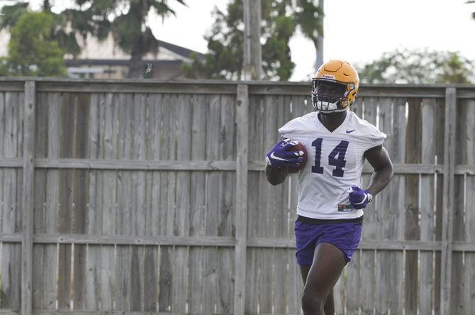 LSU sophomore wide receiver Drake Davis (14) runs with the ball at football practice on Monday, Aug. 21, 2017, at the McClendon Practice Field.